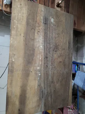 Wooden bed frame and table will be sold.