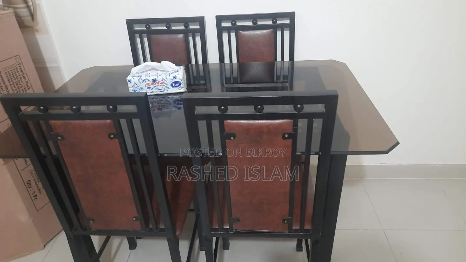 4-chair glass dining table.