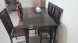 4-chair glass dining table.