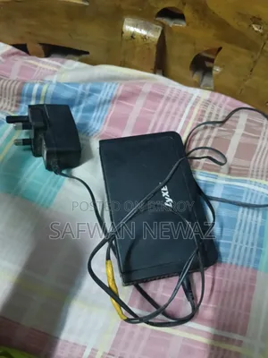 The device marked in the picture is a ZyXEL ES-108E network switch.