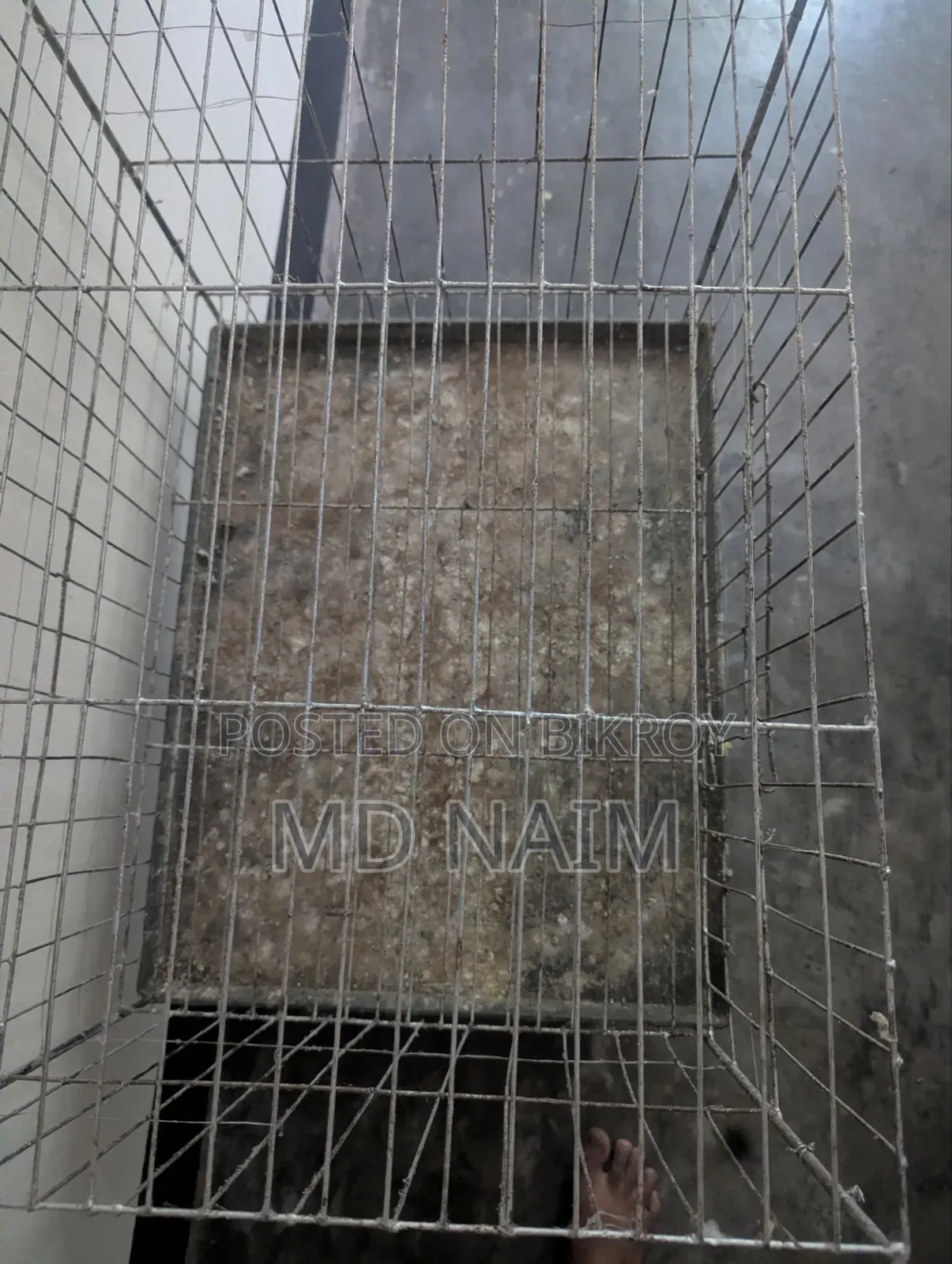 A 2-story thick wire pigeon cage
