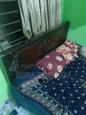 আধুনিক ডিজাইনের সুন্দর পার্টেক্স/মেলামাইন বোর্ডের ডাবল খাট বিক্রি হবে
