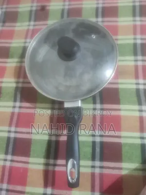 Non-stick frying pan with lid for sale.