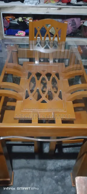 Glass table and 4 chairs for sale. All are in good condition.