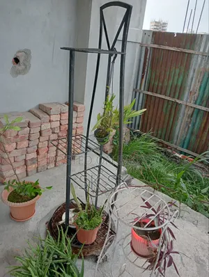 13 pcs plant stands for sale, along with many free plants, soil, and pots