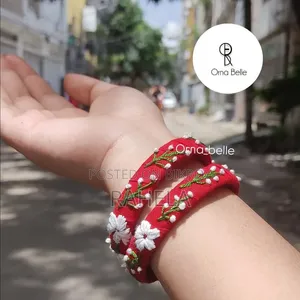 ​"লাল রঙের হাতে তৈরি চুড়িতে বসন্তের ছোঁয়া - Orna Belle"