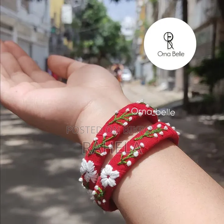 ​"লাল রঙের হাতে তৈরি চুড়িতে বসন্তের ছোঁয়া - Orna Belle"