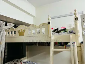 Castle-Themed Wooden Bunk Bed in a Child's Bedroom.