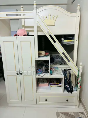 Castle-Themed Wooden Bunk Bed in a Child's Bedroom.