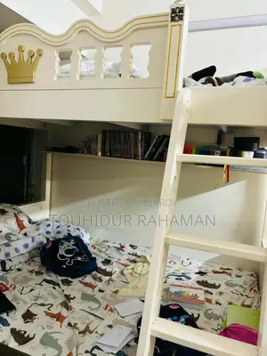 Castle-Themed Wooden Bunk Bed in a Child's Bedroom.