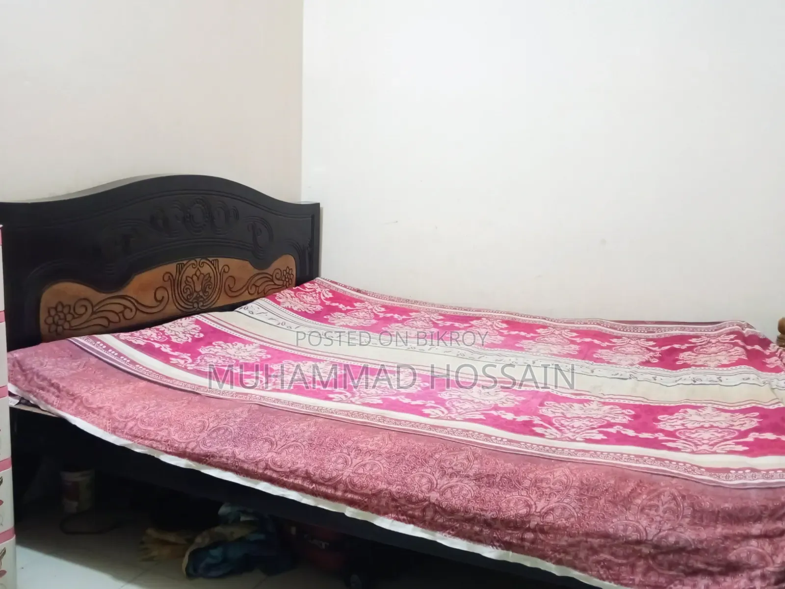 Wooden bed cot. Length and width are 6 feet by 7 feet.