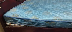 Queen Size Bed and a King Size Mattress