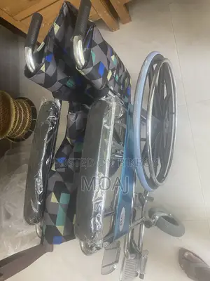 Used Manual Wheelchair – Good Condition, Slightly Damaged Wheels.