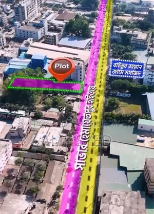 A commercial plot adjacent to the highway is for sale.