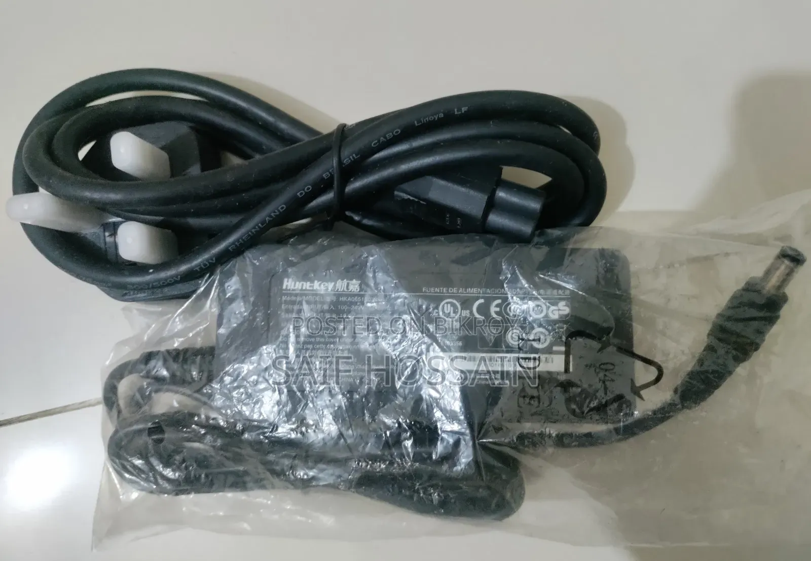 Huntkey 65w HP ল্যাপটপ চার্জার। নতুন এখনো ব্যবহার করা হয় নাই।