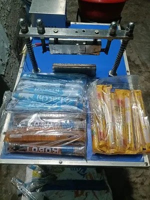 Ice lolly packing machine with raw materials.