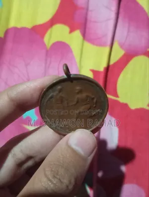 An old 19th-century metal locket/medallion