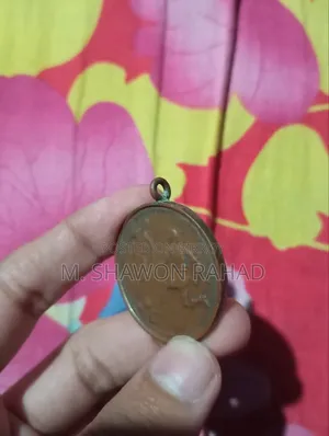 An old 19th-century metal locket/medallion