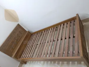 Teak wood bed.