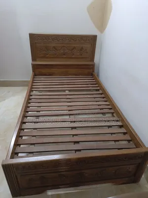 Teak wood bed.