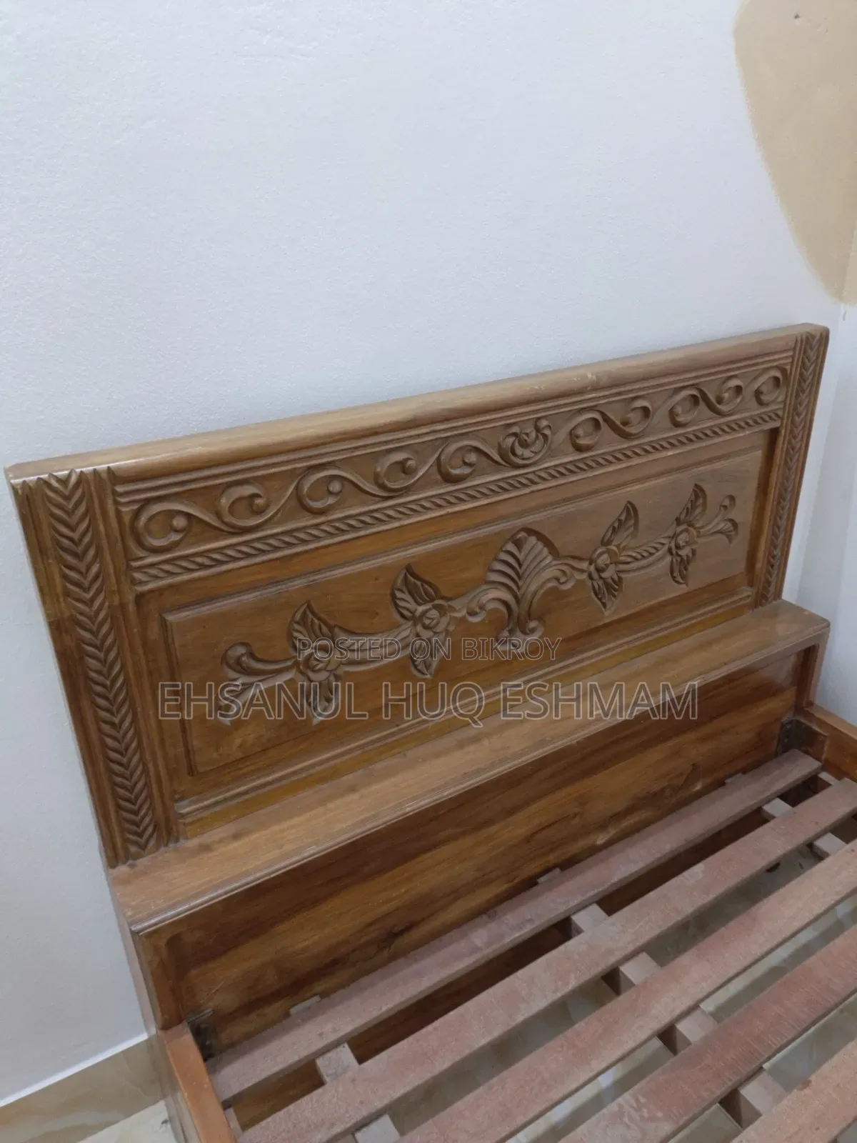 Teak wood bed.