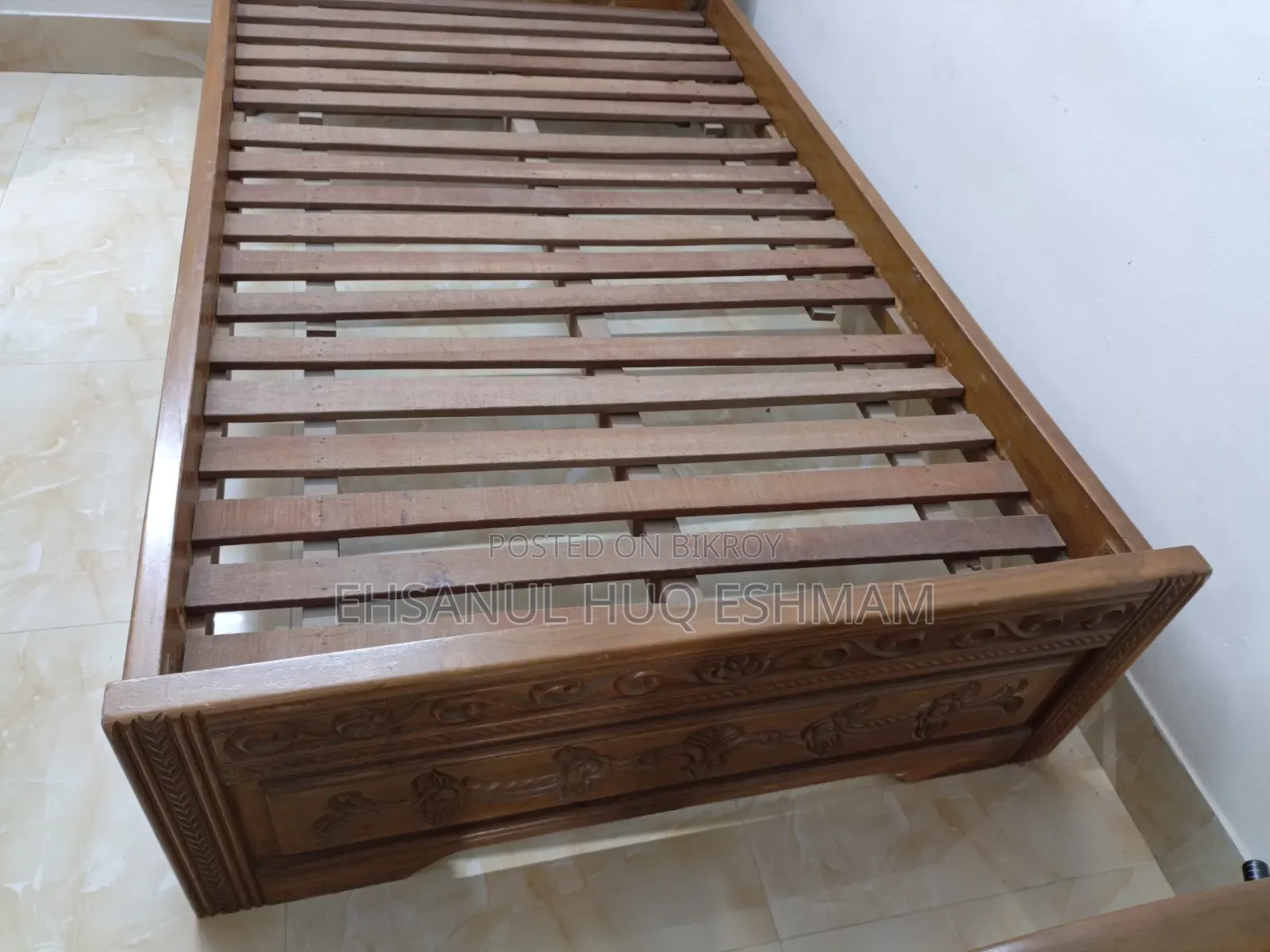 Teak wood bed.