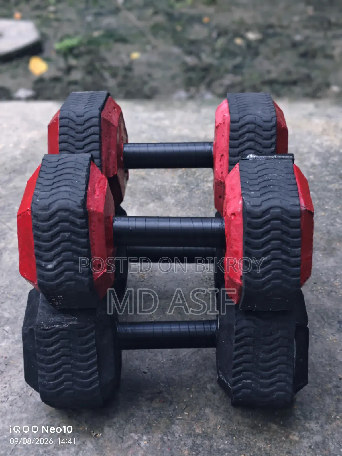 Dumbbells made with a stone mixture. These are sturdy and have precise weight.