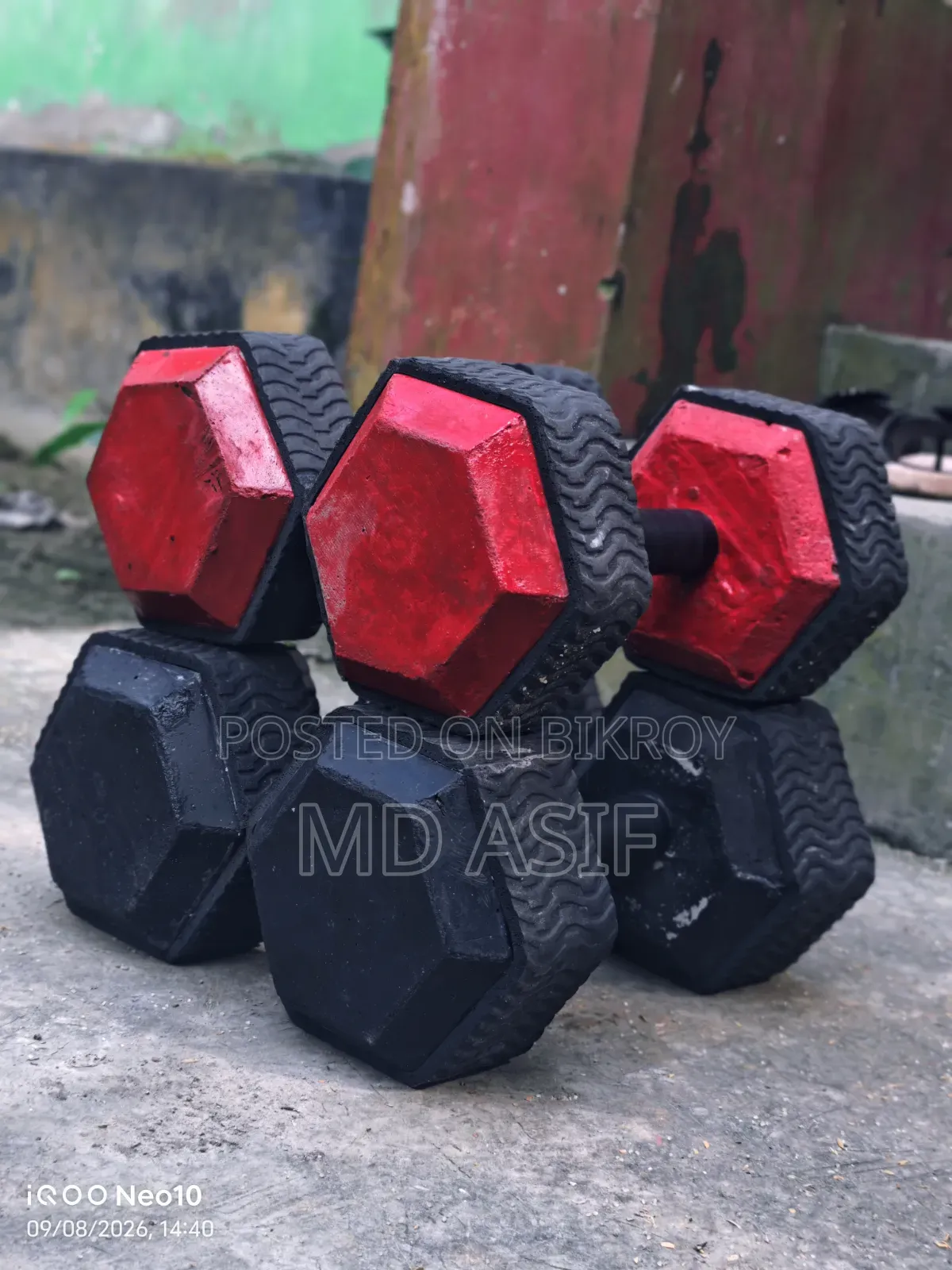 Dumbbells made with a stone mixture. These are sturdy and have precise weight.