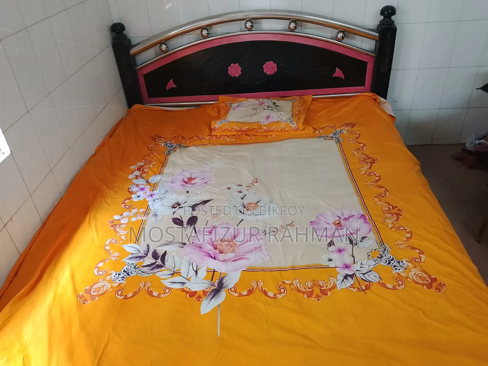 An iron bed and mattress will be sold.