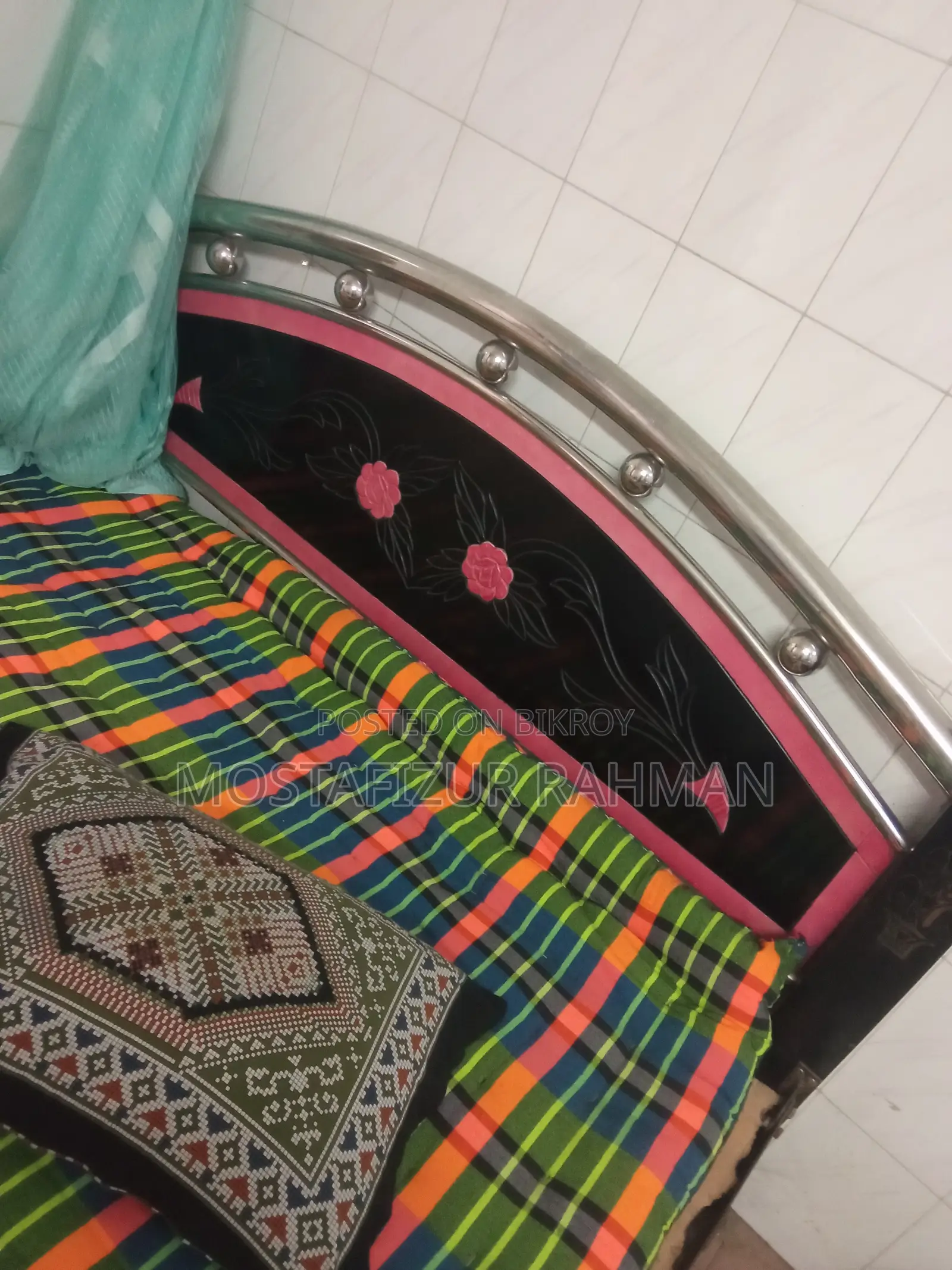 An iron bed and mattress will be sold.