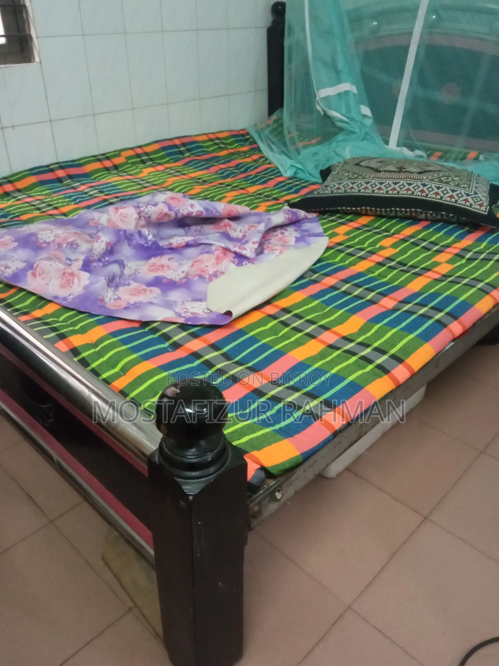 An iron bed and mattress will be sold.