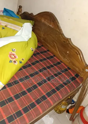 A wooden bed for three people will be sold