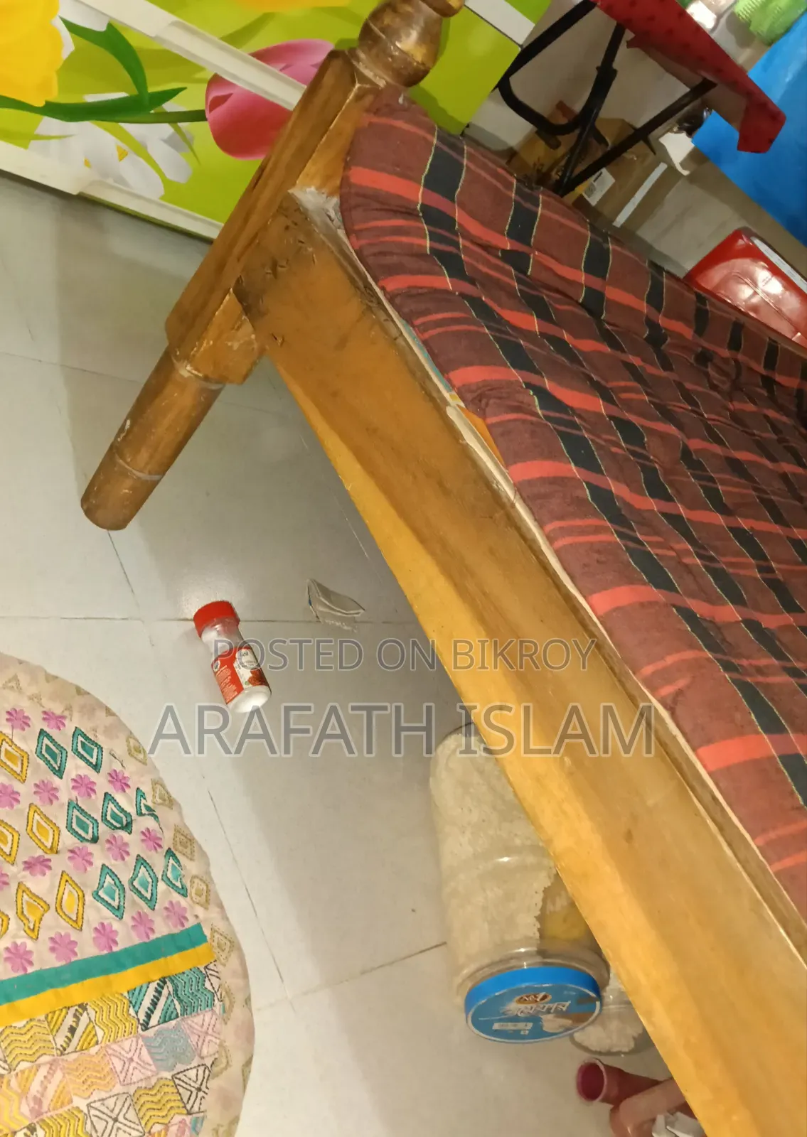 A wooden bed for three people will be sold
