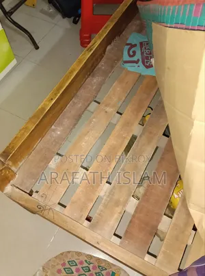 A wooden bed for three people will be sold