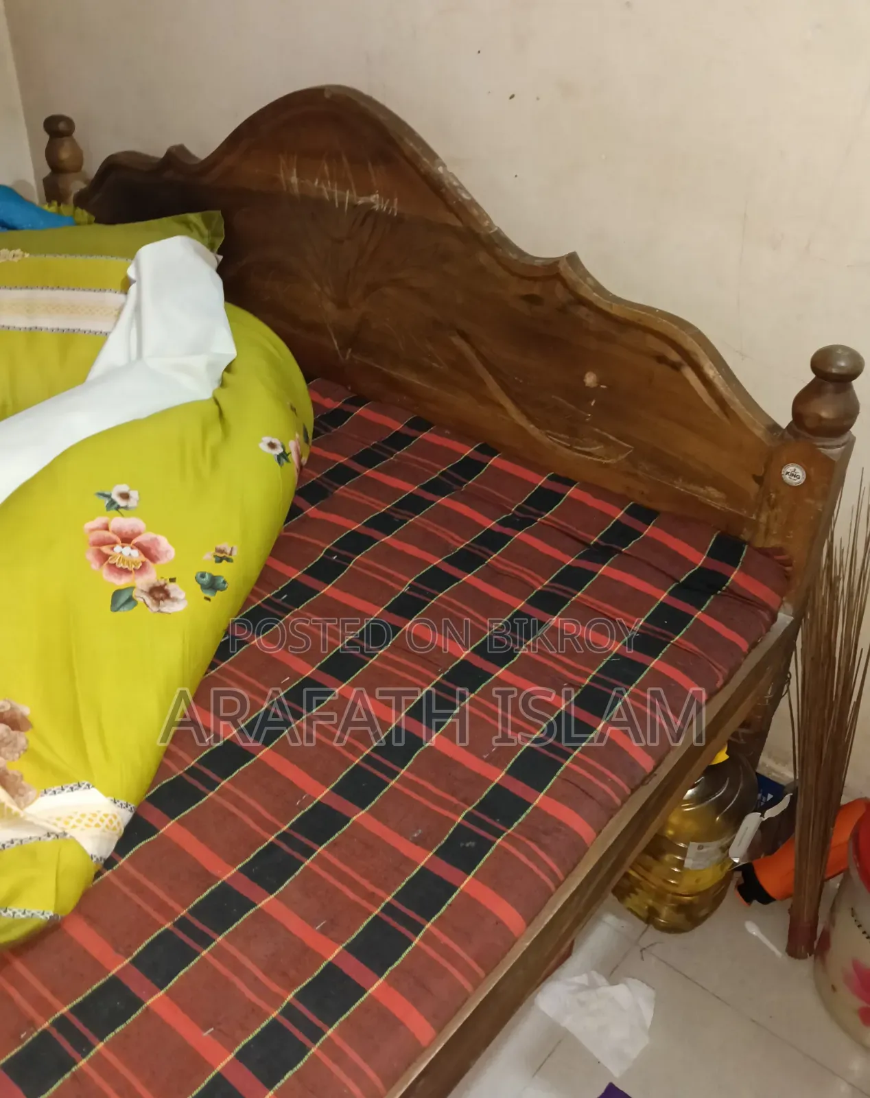 A wooden bed for three people will be sold