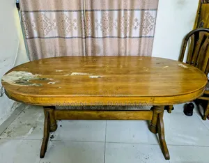 A complete solid teak wood dining table and 6 chairs will be sold.