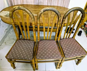 A complete solid teak wood dining table and 6 chairs will be sold.