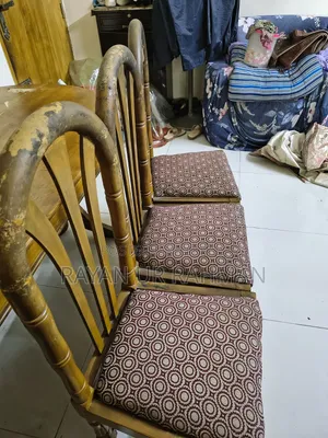 A complete solid teak wood dining table and 6 chairs will be sold.