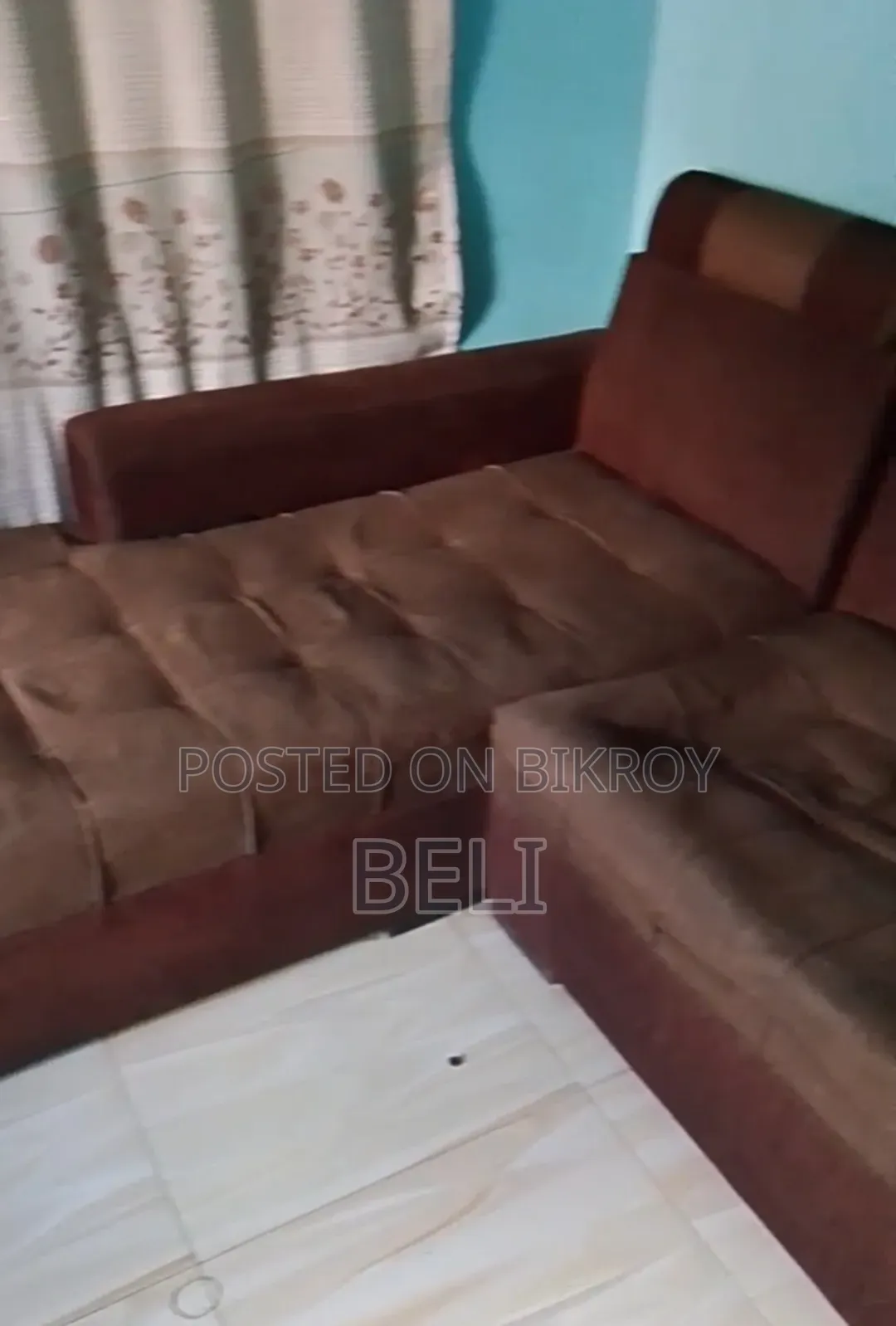 L Shape Sofa in Brown Color.
