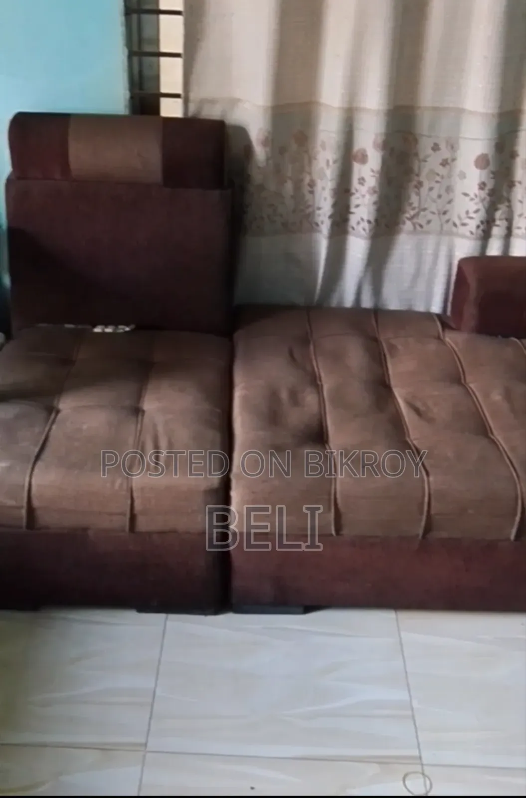 L Shape Sofa in Brown Color.