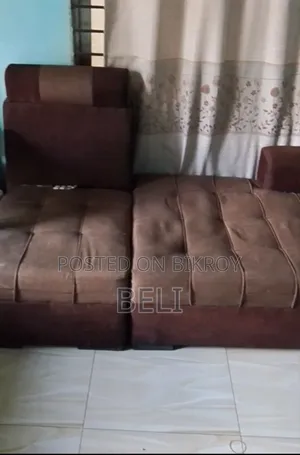 L Shape Sofa in Brown Color.