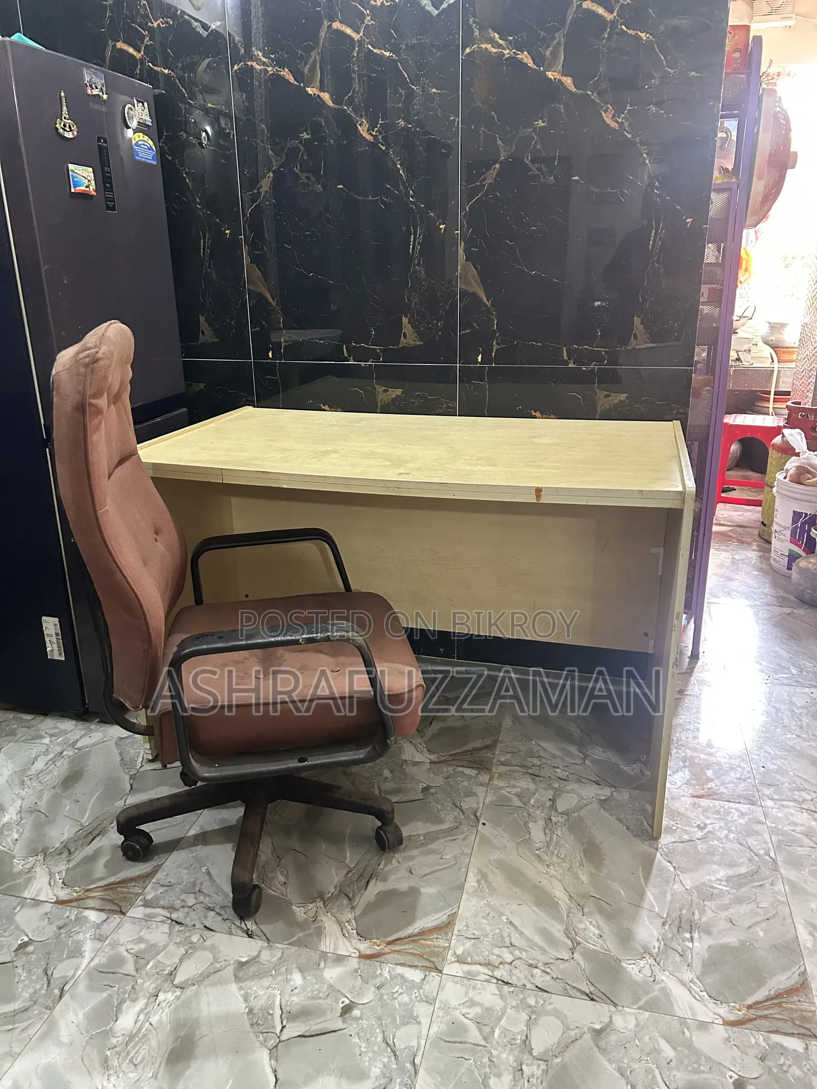 An office table and a high quality moving chair will be sold
