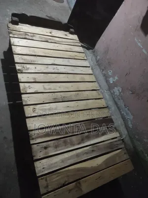 Wooden bed for sale.