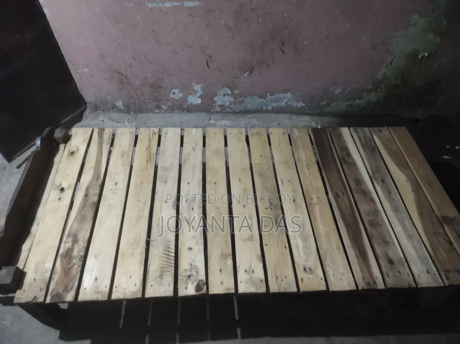 Wooden bed for sale.