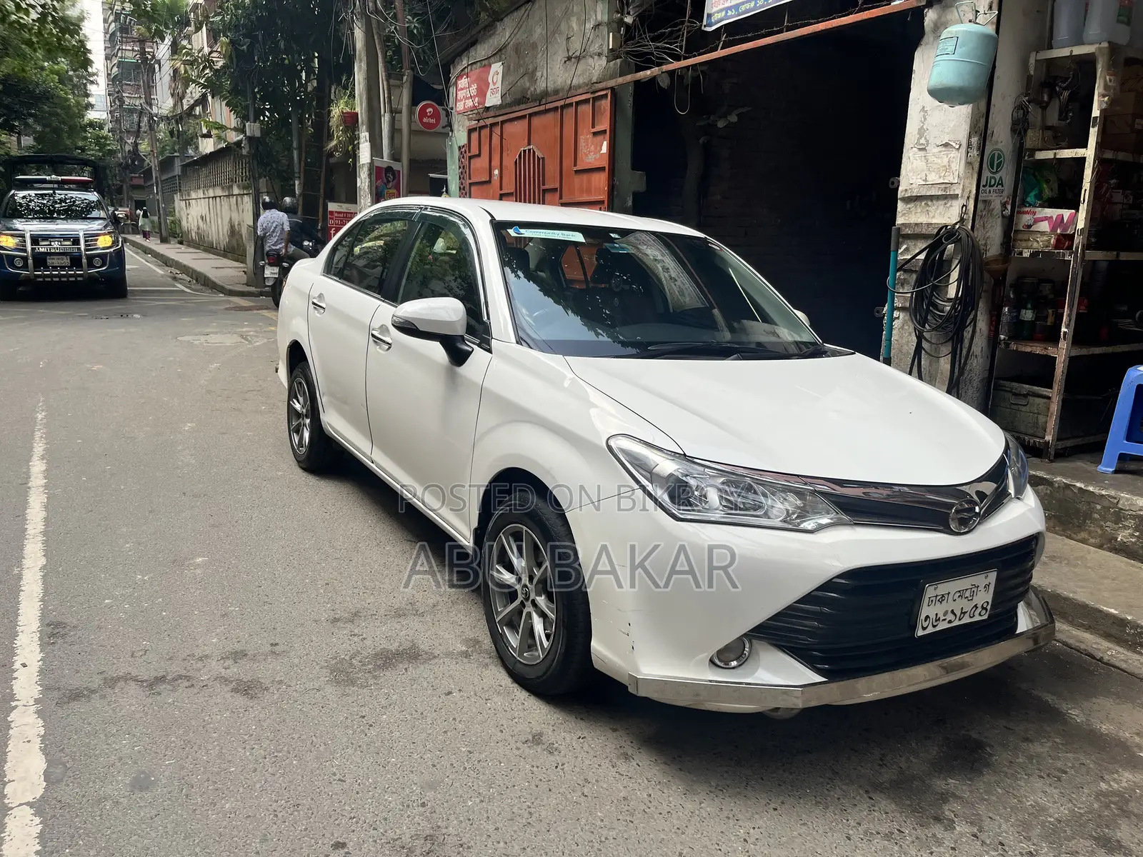 টয়োটা অ্যাক্সিও ১.৫ জি ২ডব্লিউডি ২০১৫ সাদা