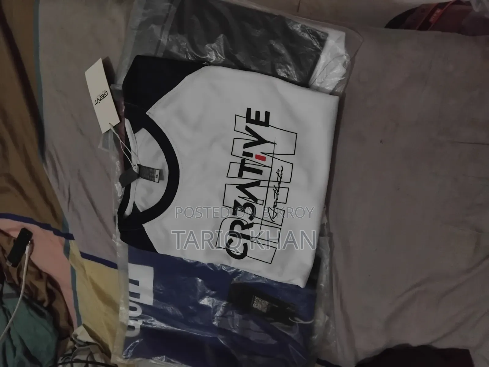 5 T-shirts for sale.