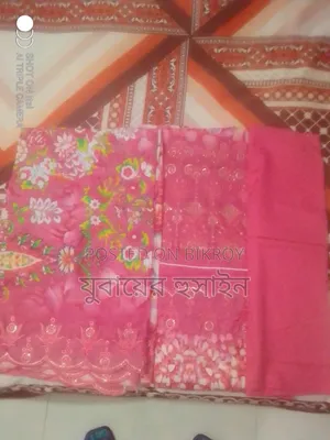 শুতি কাপড়ের মধ্যে জামা ওরনায় এম্বোডারি ও সিকোয়েন্স এর কাজ করা।