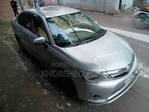 টয়োটা অ্যাক্সিও ১.৫ হাইব্রিড জি ২ডব্লিউডি ২০১৩ সিলভার
