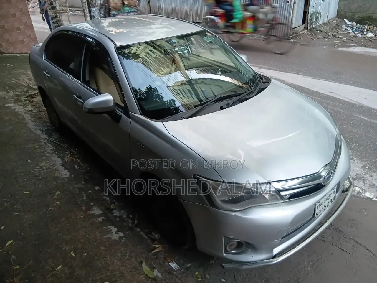 টয়োটা অ্যাক্সিও ১.৫ হাইব্রিড জি ২ডব্লিউডি ২০১৩ সিলভার