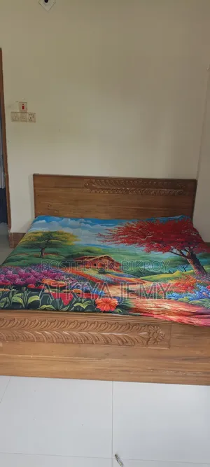 Bed, wardrobe, computer table and chair.